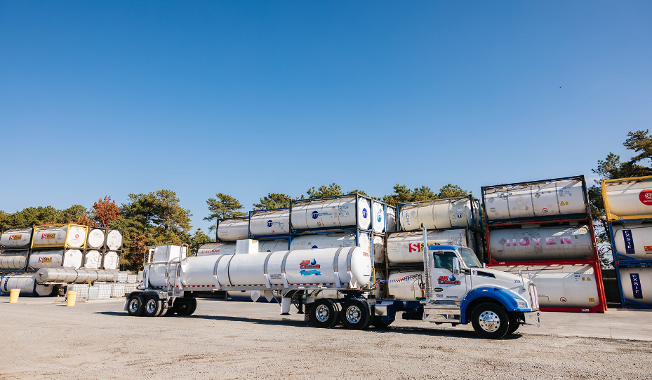 all-chem-truck-with-hazmat-tanker-along-iso-containers